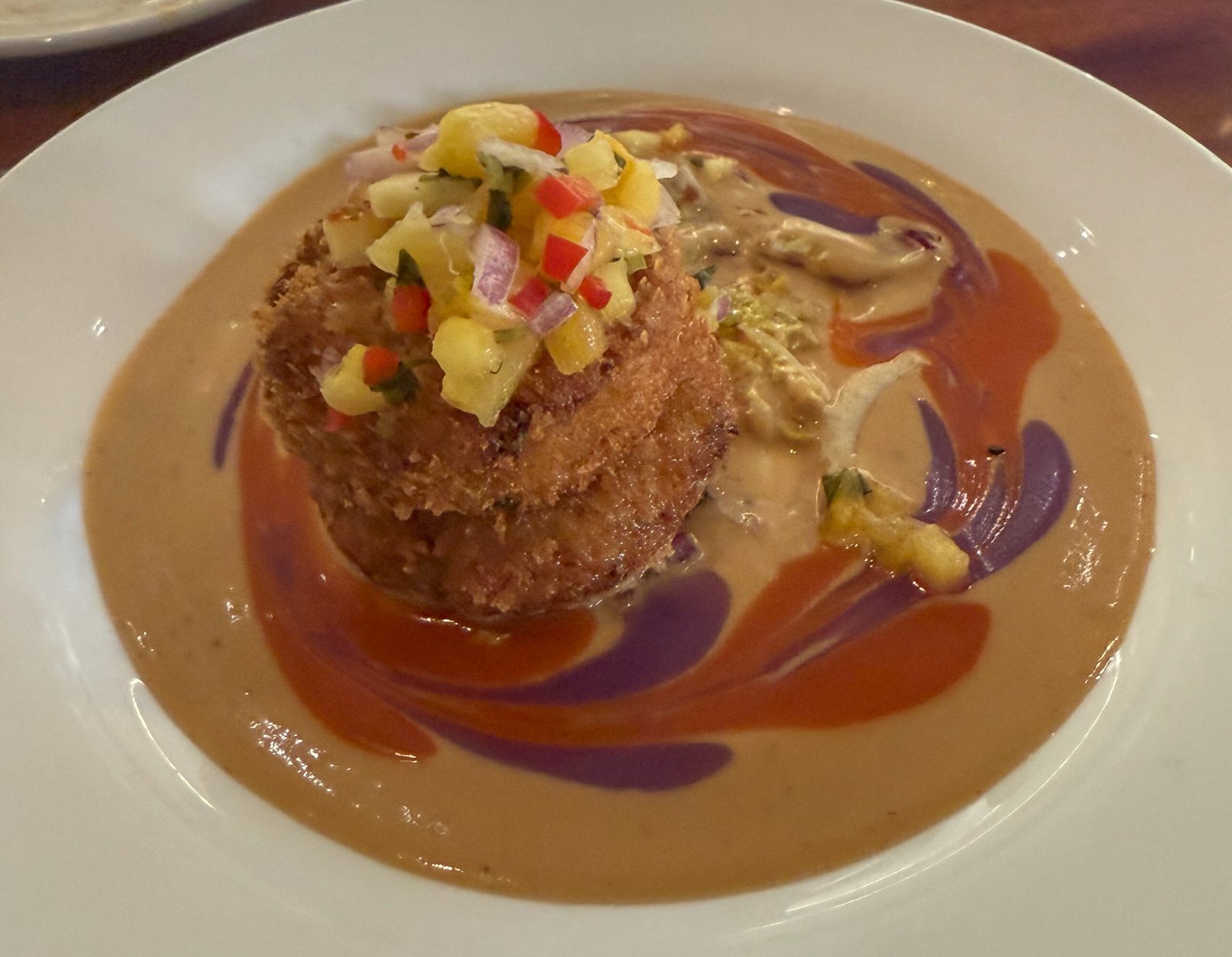 Housemade Crab Cakes, served with Red Thai Curry sauce